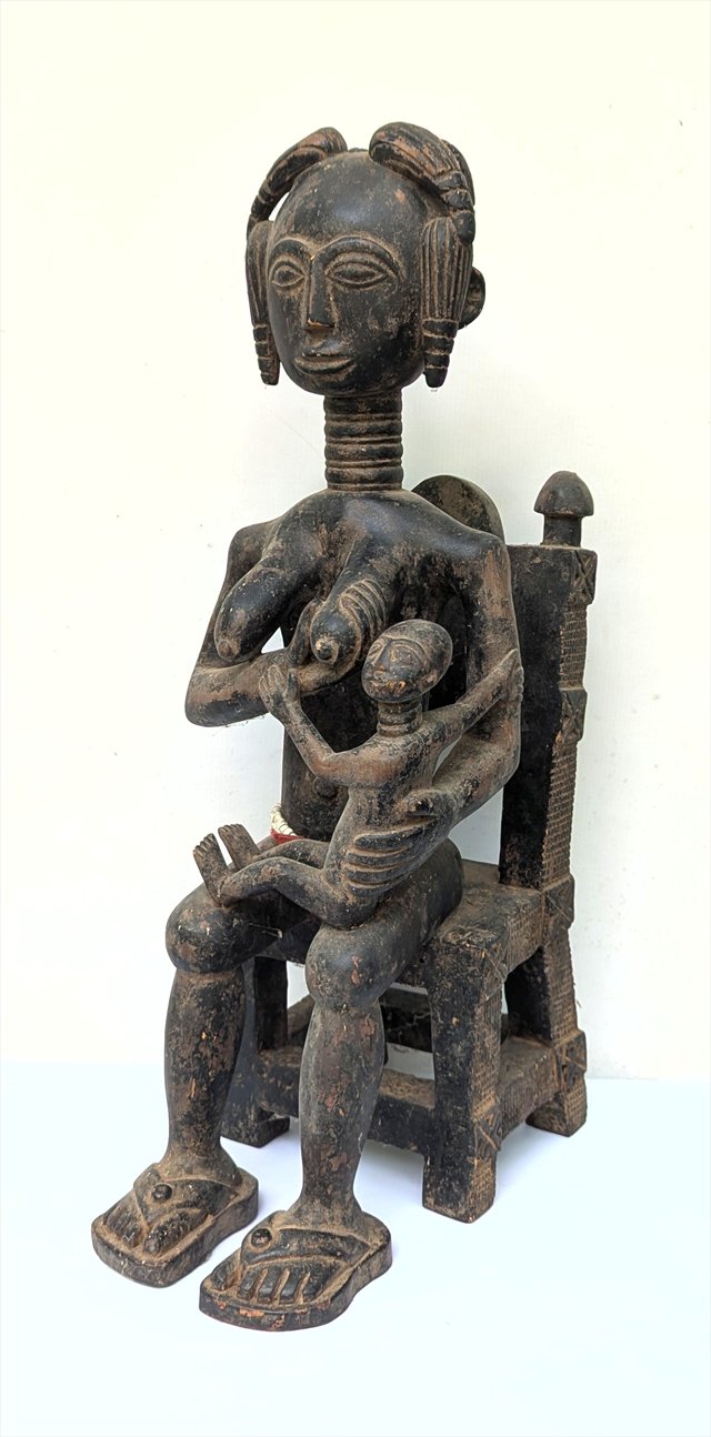 Baule Maternity Figure Seated on Chair, Cote d'Ivoire — view 1