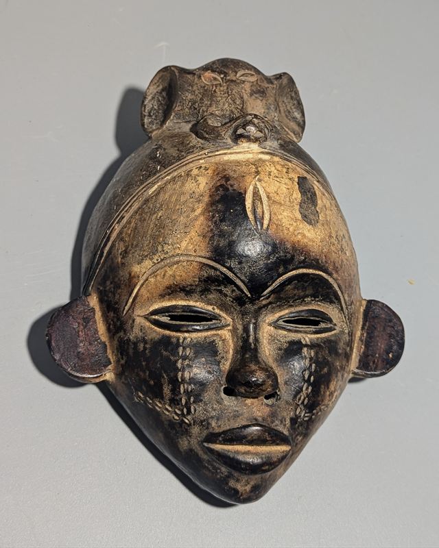 A Baule or Guro carved wooden mask, Ivory Coast