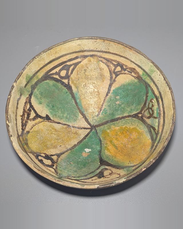 Early Islamic Persian Polychrome Buff-Ware Bowl with Radial Floral Decoration, Probably Nishapur — view 1 of 5